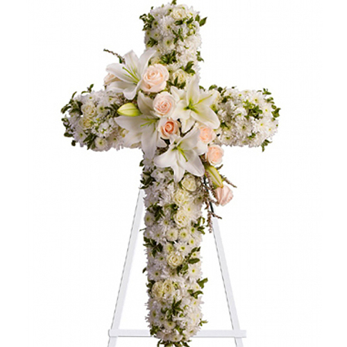 Cruz fúnebre de margarita y lilium blancos con rosas tono pastel